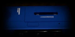 LoFi Pro 2, MICROCASSETTE: a metallic blue dictation recorder, close on its cassette door