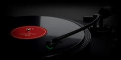 LoFi Pro 2, VINYL 33: a black turntable’s tone arm down on a record with a red label