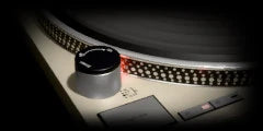 LoFi Pro 2, WOBBLE: close on a turntable platter’s rim of strobe dots beside its pitch knob