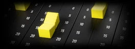 Reverse King 3, FADE: long-throw console faders with yellow caps against an engraved dB scale
